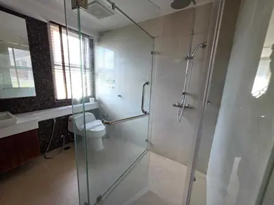 a bathroom with a glass shower and a toilet at Penthouse 3 bedrooms with sea view and pool - Privilege residence in Patong Beach