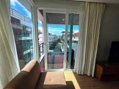 a living room with a couch and a large window at Penthouse 3 bedrooms with sea view and pool - Privilege residence in Patong Beach