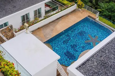 an overhead view of a swimming pool next to a building at C236 Best Pool &Sea View 2BR Condo Prime Location in Karon Beach