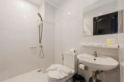a white bathroom with a shower and a sink at C237 Brand New 1BR Condo Pool Gym Near Beach in Bang Tao Beach