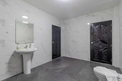 a bathroom with a sink and a black door at V245 3BR with Pool Close to Phuket Best Beaches in Rawai Beach