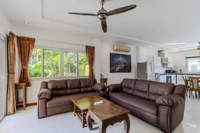 a living room with two leather couches and a table at V245 3BR with Pool Close to Phuket Best Beaches in Rawai Beach