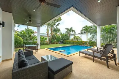 a living room with a swimming pool in a house at V246 Spacious 4BR Near Pier Private Pool & Garden in Rawai Beach