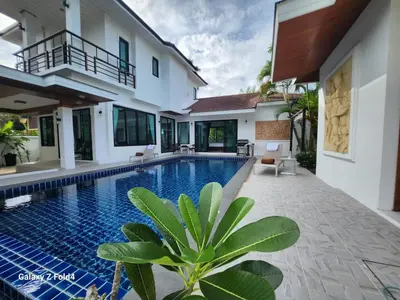 a villa with a swimming pool and a house at HEART of RAWAI, 4BR Private pool in Rawai Beach