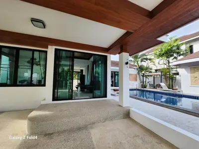 an external view of a house with a swimming pool at HEART of RAWAI, 4BR Private pool in Rawai Beach