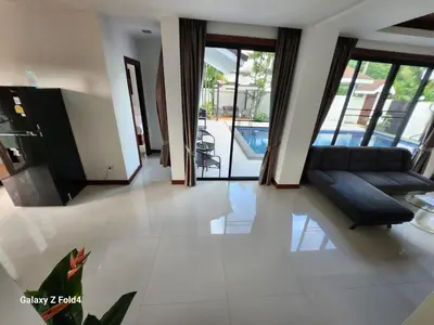 a living room with a couch and a table at HEART of RAWAI, 4BR Private pool in Rawai Beach