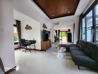 a living room with a couch and a piano at HEART of RAWAI, 4BR Private pool in Rawai Beach