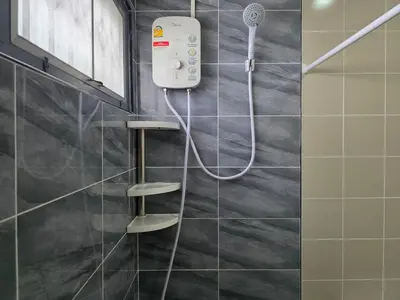 a shower in a bathroom with a shower head at Moonlight Naka in Ban Rangeng
