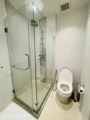 a bathroom with a shower and a toilet at Daimond resort condominium by koy in Patong Beach