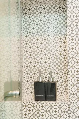 a bathroom with two soap dispensers and a mirror at Cassia Exclusive Lake View Condo Bang Tao Beach in Phuket Town