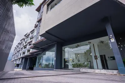 a store front of a building with glass windows at Apartment Seaview Rooftop Pool Surin beach 650m in Surin Beach