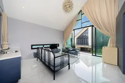 a living room with a couch and a table at Designer Loft Villa Retreat in Pasak, Laguna Area in Ban Pak Lak