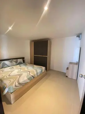 a bedroom with a large bed in a room at Bayshore 2 Bedroom Spacious Seaview Apartment in Patong Beach