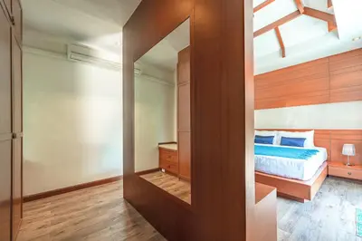 a bedroom with a bed and a glass door at 3 Bedrooms villa walking distance to Rawai beach in Rawai Beach