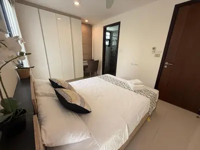 a bedroom with a bed with two pillows on it at Laguna Park Phuket 5BR Villa with Rooftop Pool #84194 in Laguna Phuket