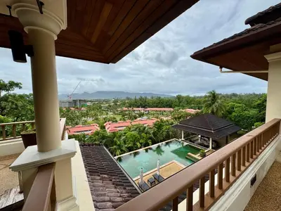 a balcony with a view of a swimming pool at \u6574\u680b\u9ad8\u5962\u5eb7\u517b\u6cf3\u6c60\u522b\u5885 - \u5e26\u53a8\u5e08\u5973\u4f63 in Layan Beach