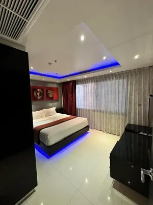 a bedroom with a bed with a blue led lighting at L08 Penthouse Suite Modern Condo On Bangla Road in Patong Beach