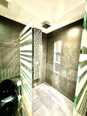 a bathroom with a shower with a glass door at L08 Penthouse Suite Modern Condo On Bangla Road in Patong Beach
