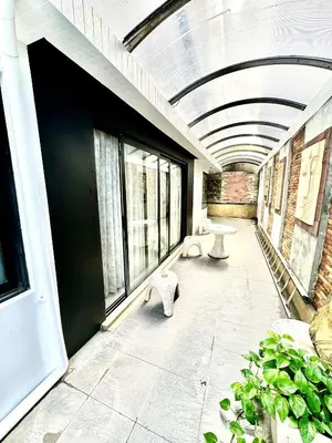 a room with a building with a ceiling with windows at L08 Penthouse Suite Modern Condo On Bangla Road in Patong Beach