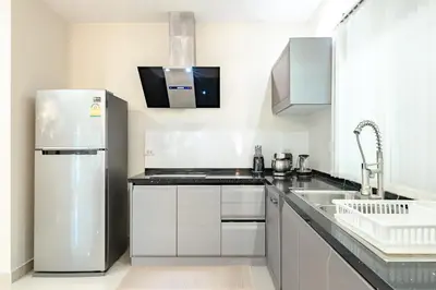 a kitchen with a refrigerator and a sink at Platinum Villa Rawai in Rawai Beach