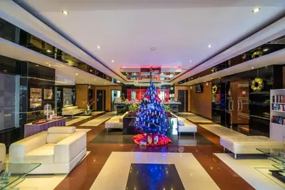 a christmas tree in the lobby of a hotel at L02 Bangla Suites Modern Studio On Bangla Road in Patong Beach