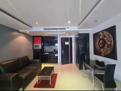 a living room with a couch and a table at L02 Bangla Suites Modern Studio On Bangla Road in Patong Beach