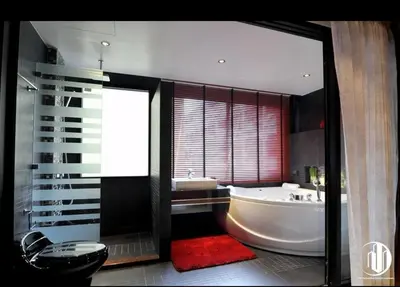 a large bathroom with a tub and a red rug at L02 Bangla Suites Modern Studio On Bangla Road in Patong Beach