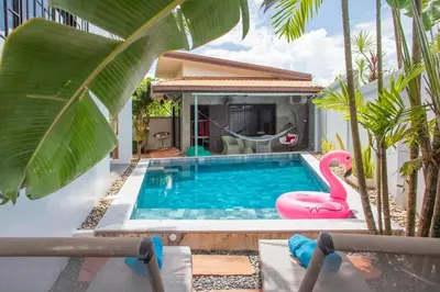 a swimming pool with a pink flamingo in a house at 150 m from a paradise beach 3 bedrooms pool in Klong Muang Beach