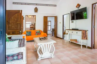 a living room with a couch and a table at Villa with private pool and mountain views in Ban Khlong Son