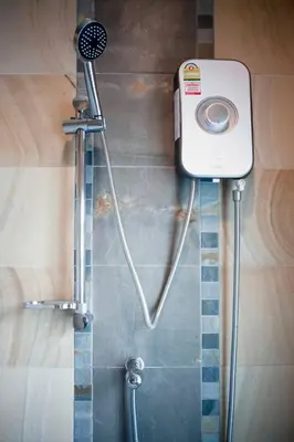 a shower in a bathroom with a shower at Jaccuzi House 5 pl 200 m from a beautiful beach in Klong Muang Beach