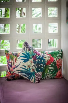 two pillows sitting on a bed in front of a window at Jaccuzi House 5 pl 200 m from a beautiful beach in Klong Muang Beach