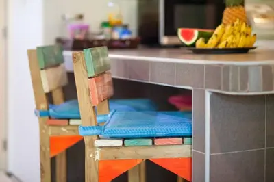 a toy kitchen with two chairs and a counter at Jaccuzi House 5 pl 200 m from a beautiful beach in Klong Muang Beach