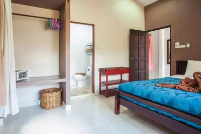 a bedroom with a bed and a bathroom with a toilet at House 4 people sea view 100 m from the beach in Klong Muang Beach