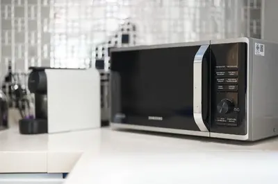 a microwave sitting on a counter in a kitchen at Platinum Villa 4 bedrooms Rawai in Rawai Beach