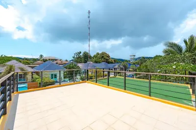 a tennis court on the balcony of a house at Platinum Villa 4 bedrooms Rawai in Rawai Beach