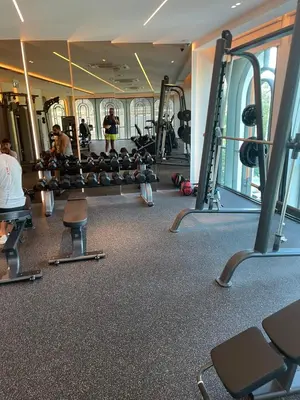 a gym with tread machines and people in it at Andaman 3 in Ban Thalat Choeng Thale