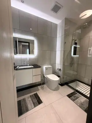 a bathroom with a toilet and a sink and a shower at Andaman 3 in Ban Thalat Choeng Thale