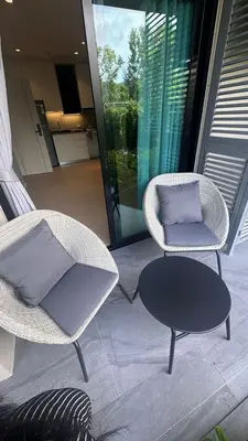 two chairs and a table on a patio at Andaman 3 in Ban Thalat Choeng Thale