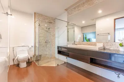 a bathroom with a toilet and a sink and a shower at Majestic 2BR Residence with garden view in Regent in Bang Tao Beach