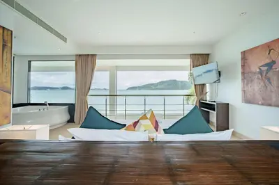 a living room with a couch and a bath tub at Raya Villa 2 Bed Beachfront Villa Private Pool in Rawai Beach
