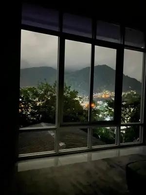 a view of a city from a window at Jungle House Phuket - Seaview Retreat in Patong Beach