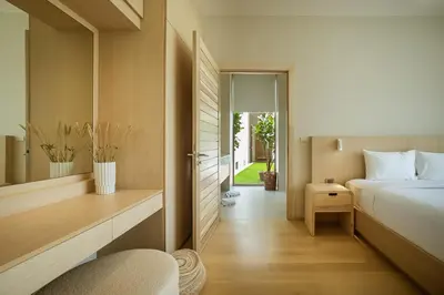 a bedroom with a bed and a desk with a chair at Akal pool villa 3BR near Laguna, Bangtao & Beach in Bang Tao Beach