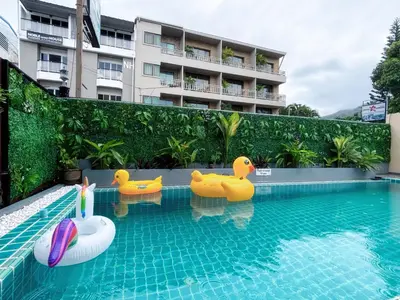 a pool with rubber ducks in a swimming pool at Patong Leisure Hotel in Patong Beach