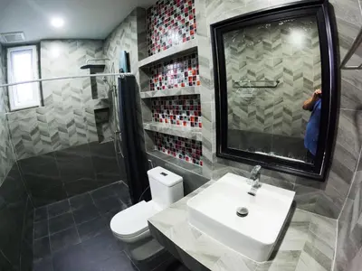 a bathroom with a sink and a toilet and a shower at Krabi Top Sea Hill Villa in Klong Muang Beach