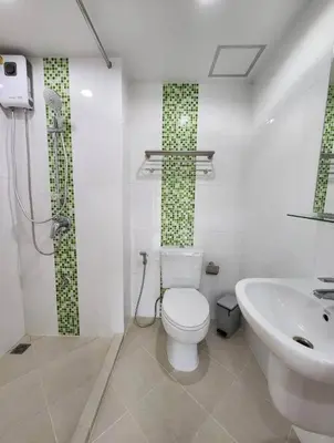 a bathroom with a toilet and a sink at Plus 2 condo by Tida 111 in Kathu