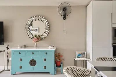 a room with a blue cabinet and a mirror at Spectacular two bed penthouse amazing sea views in Patong Beach
