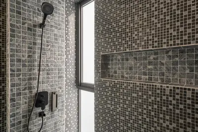 a bathroom with a shower with a shower head at Spectacular two bed penthouse amazing sea views in Patong Beach