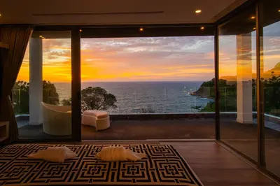 a living room with a view of the ocean at Seascape 6BR Prestige Villa Skyline Pool in Kamala Beach