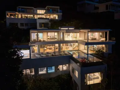 a building with lights on at night at Seascape 6BR Prestige Villa Skyline Pool in Kamala Beach