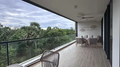 a room with a balcony with a table and chairs at 3bdr new apartmet in Laguna 50m form beasch LBS-3504 in Bang Tao Beach
